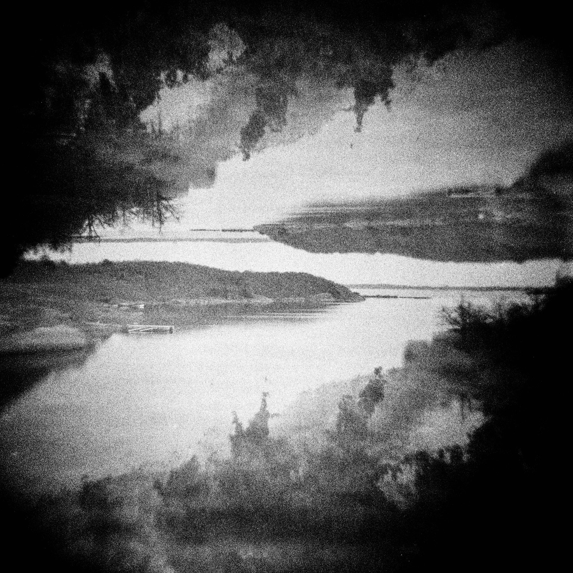 Adjacencies — black and white in-camera double exposure of a wooded Swedish coastline mirrored upside down, Blekinge, Sweden.